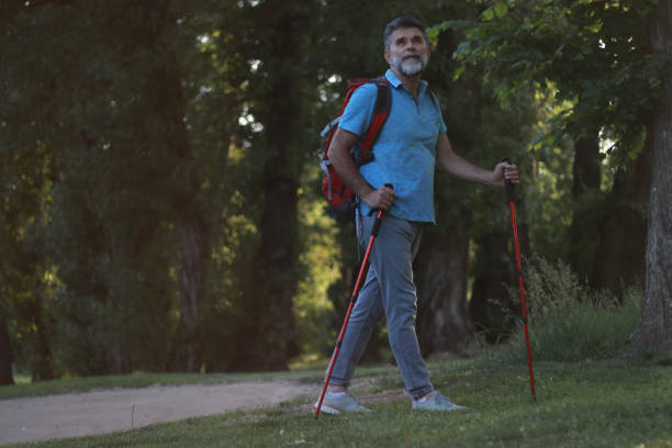 istock Mature casual man hiking trough forest 1674165646