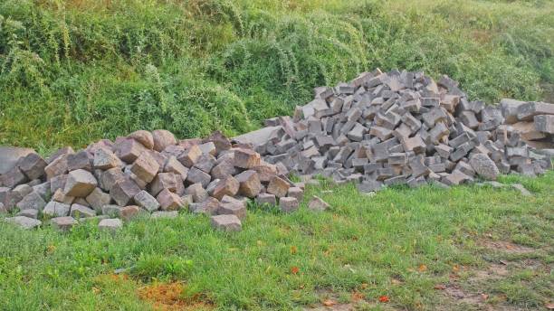 istock Heap Pile of Cobblestone Bricks Stored Outdoors at Roadworks Construction Site 1674172715