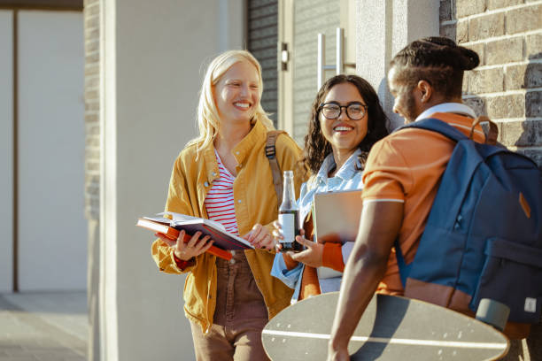 istock Diverse group of happy students hanging out after class 1674196535