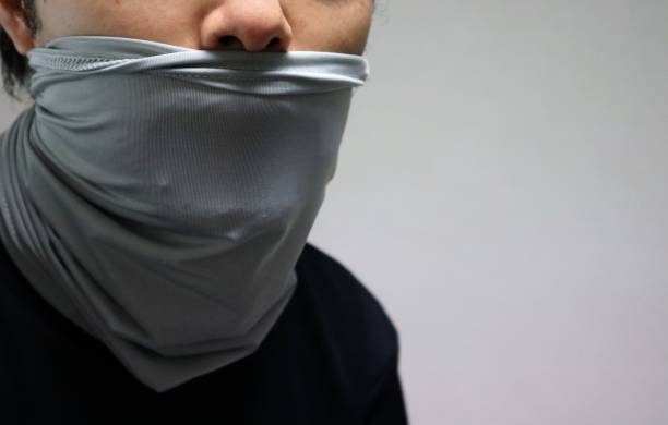 istock Japanese man wearing a face covering 1674209775