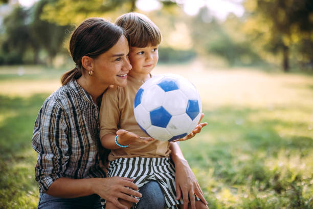 istock Mother and son play together 1674210853