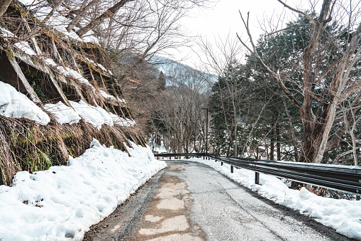 A road to the mountain at shirakawago in the winter