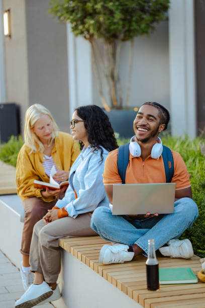 istock African American male student using laptop on the bench on campus 1674217460