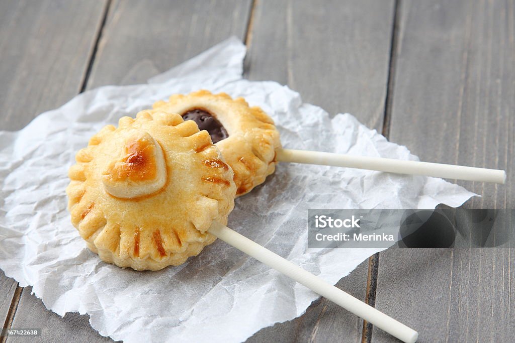 Pie pops with chocolate Pie pops with chocolate. Homemade shortbread cookies on a stick Backgrounds Stock Photo