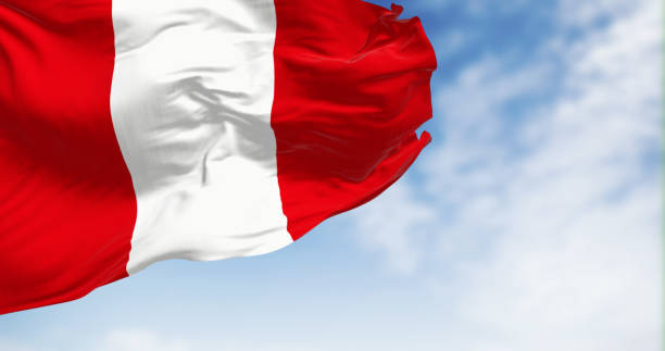 istock Peru national flag waving in the wind on a clear day 1674238973