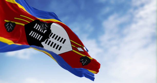 eswatini national flag waving a clear day - swaziland imagens e fotografias de stock