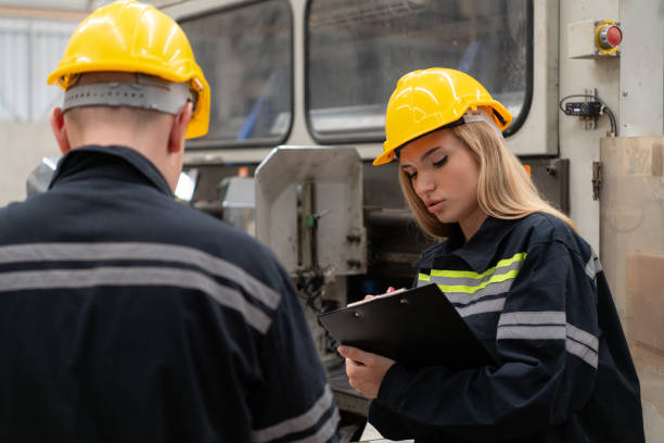 istock Both of engineer workers working on a machine in a factory. Industrial background 1674270059