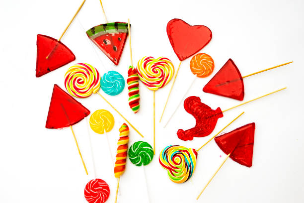 istock Different candies. Gummy sticks and various lollipops isolated on white background. 1674277316