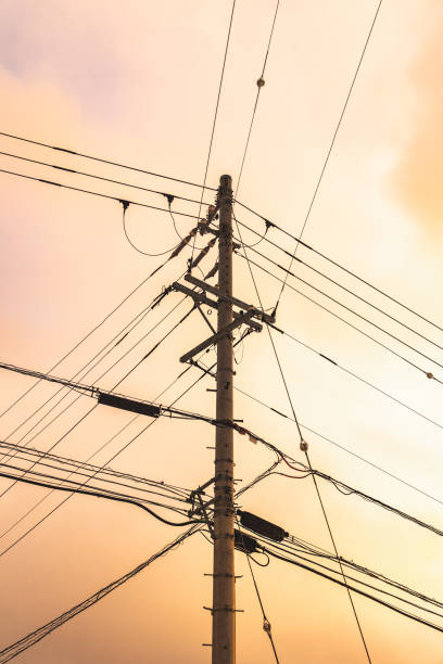 istock Electric high voltage tower with electric line at sunset 1674277362