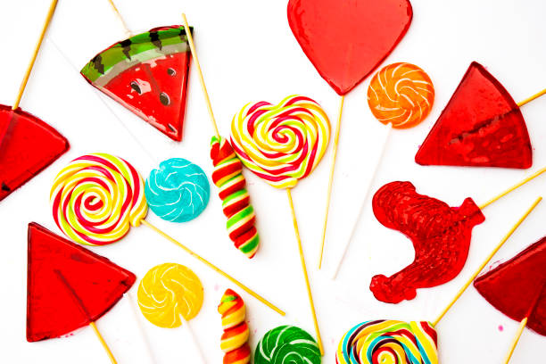 istock Different candies. Gummy sticks and various lollipops isolated on white background. 1674277888