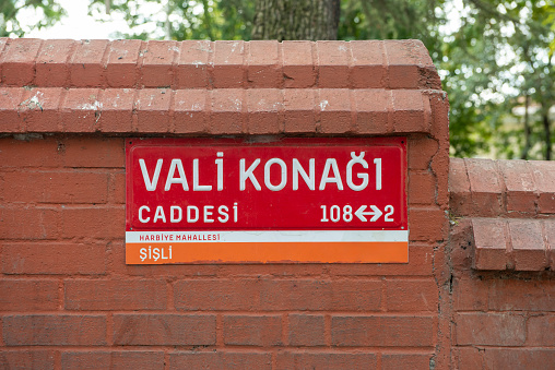 Red street sign of Vali Konağı street in Nişantaşı neighbourhood in Istanbul