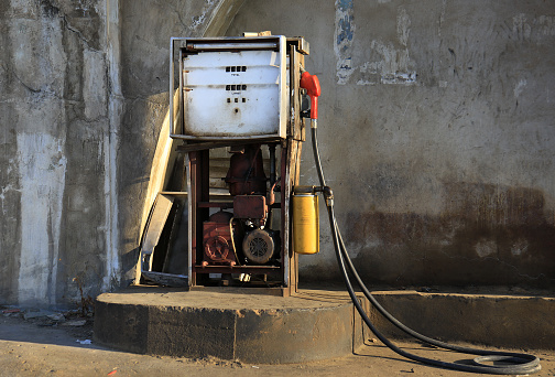 Gas station with two nozzle fuel pumps. Close-up and selective focus
