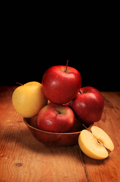 istock Apples in a bowl on wooden background 167429367