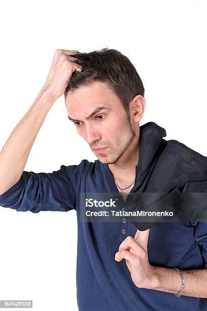 Retrato De Hombre Joven Pensando Foto de stock y más banco de imágenes de Aburrimiento - Aburrimiento, Adulto, Adulto joven