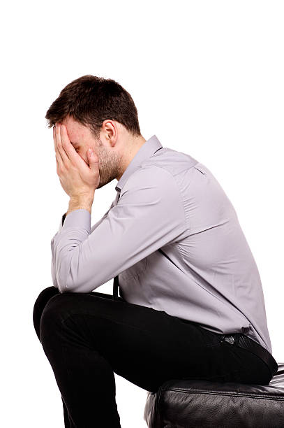 istock Business man sat in despair isolated on a white background 167429637