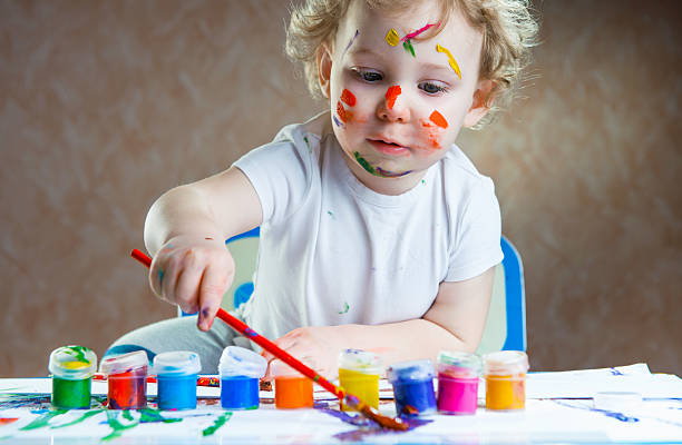 istock Cute little child painting 167429906