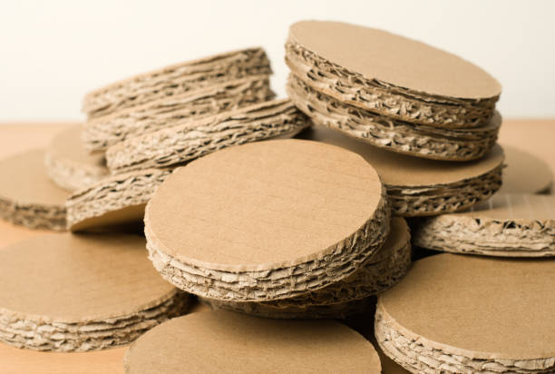 istock Pile of recycled cardboard circles on a white background. 1674301313