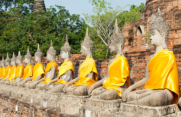 Buddhist statues in a row stock photo