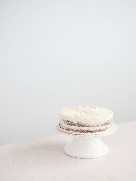 istock elegant layer naked chocolate cake on stand decorated with white buttercream icing 1674338835