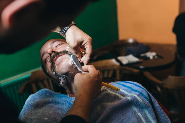 Ready for mustache challenge? Barber shaving man , preparing for the mustache Movember chalenge