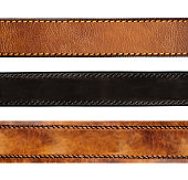 Set of leather belt of black and brown color. Collection of belts with decorative borders. Isolated on white background