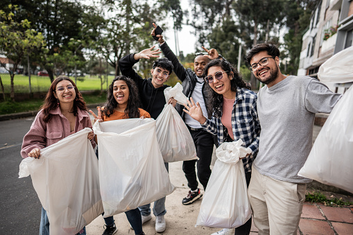 Portrait of a young volunteers group, cleaning the city neighborhood