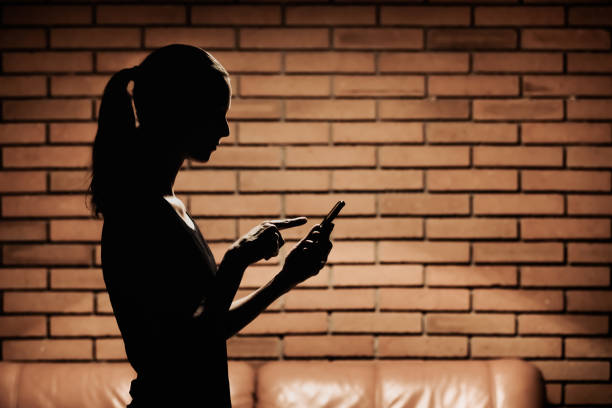 Checking cellphone.