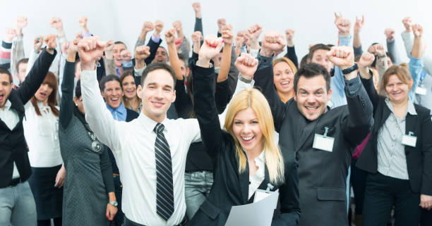 istock Business people holding fists up. 167440096