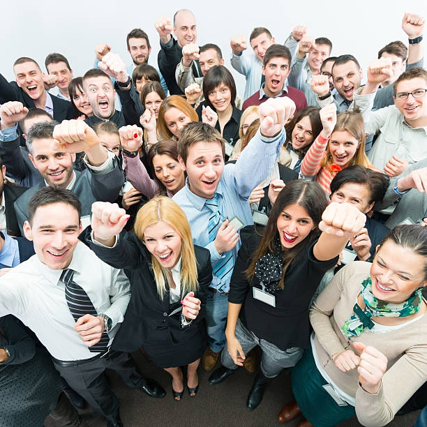 istock Business people holding fists up. 167440140