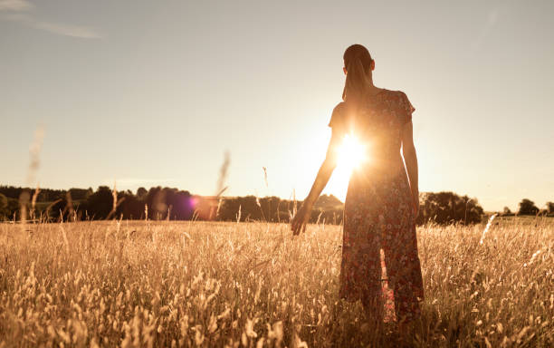 istock Woman at sunset. 1674402195