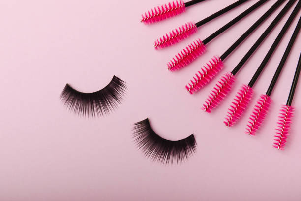 istock Composition with false eyelashes, mascara and eyelash brushes, eyelash curlers on a background. Makeup artist tools. Beauty concept. Makeup. Place for text. Place for copying. Flatley. MOCAP. 1674413949