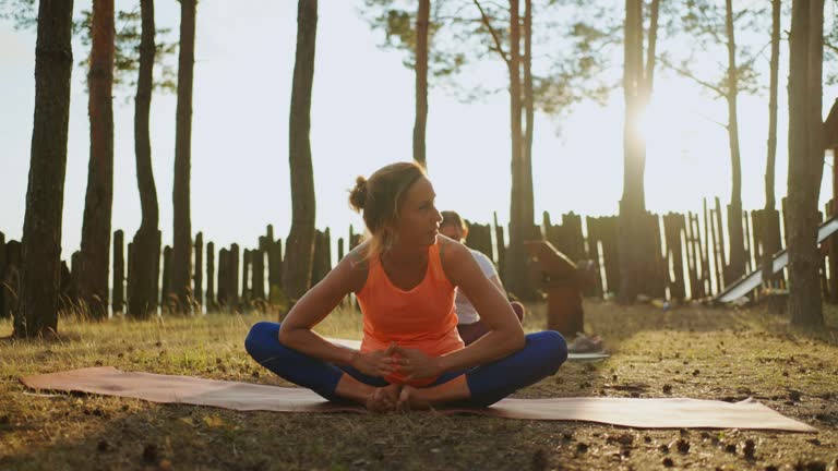 Group Yoga Practice In Nature, Women Are Training Together In Summer Camp, Healthy Lifestyle