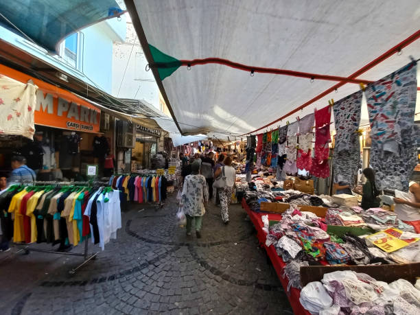 market stalls of artisans selling clothing in ayvalık bazaar - sales clerk store manual worker retail imagens e fotografias de stock