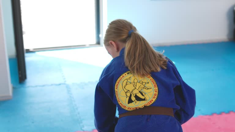 A Young Girl Demonstrating Self-Defense And Throwing Techniques