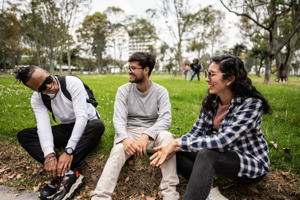 istock Young friends talking on the public park 1674442143