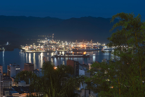 City of Santos, Brazil. September 3, 2023. DP World Container Terminal in Santos Port illuminated at night.