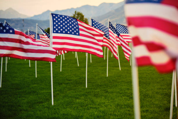 istock Large Group of American Flags 1674455633
