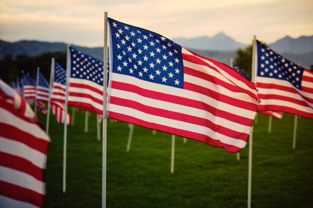 istock Large Group of American Flags 1674455648