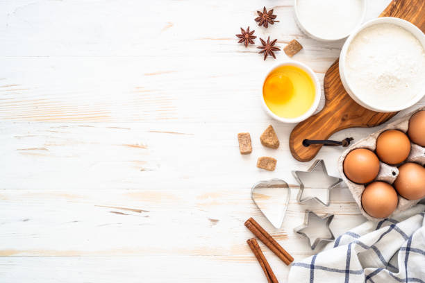 istock Baking ingredients at white wooden table. 1674467186