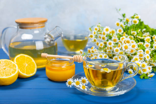 istock Chamomile tea in a  cup on a texture background. Natural hour with chamomile flowers. Herbal tea. Immunity tea.Natural healer concept. Healthy detox drink.Close up. Place for text. 1674471665