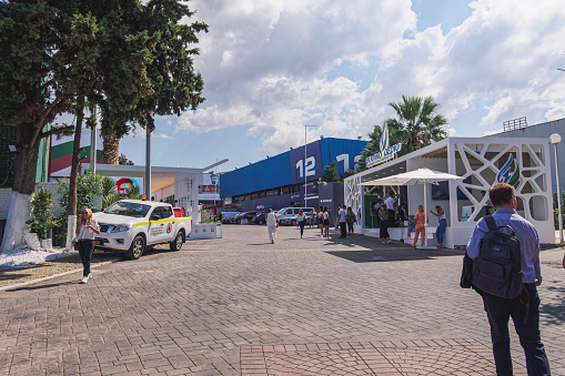 Thessaloniki, Greece - September 9 2023: Visitors outside pavilions of the 87th TIF International fair, taking place from 09 to 17 September 2023.