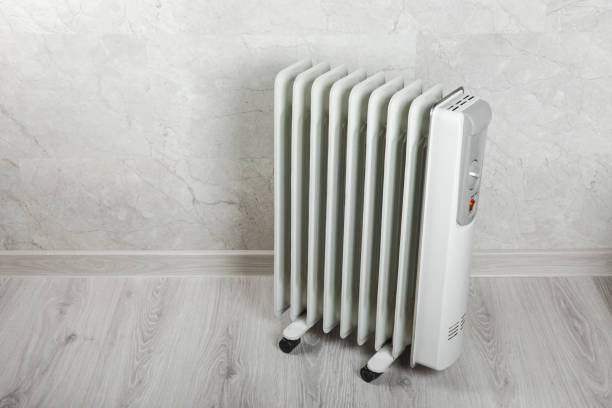 istock Different types of radiators. Heating systems store.Modern radiator at home. Central heating system. radiator, White radiator in the apartment.Expensive heating costs concept, close-up.Heating season. 1674481610