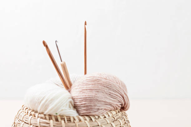 istock Craft knitting hobby background with yarn in natural colors 1674486492