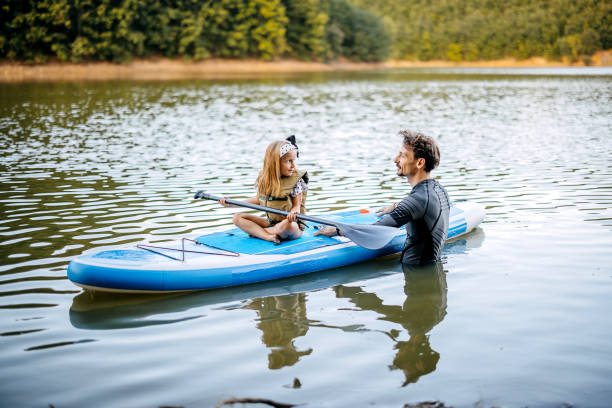 istock Father teaches his daughter to row 1674495195