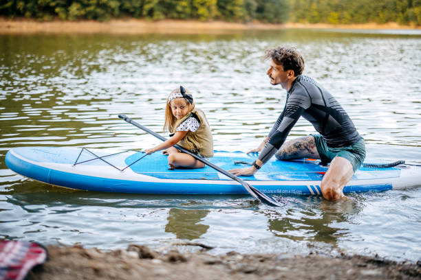 istock Father teaches his daughter to row 1674495718