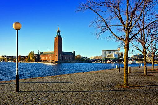 Stockholm, Sweden, view of City Hall from Evert Taubes Terrass, under late day autumn light