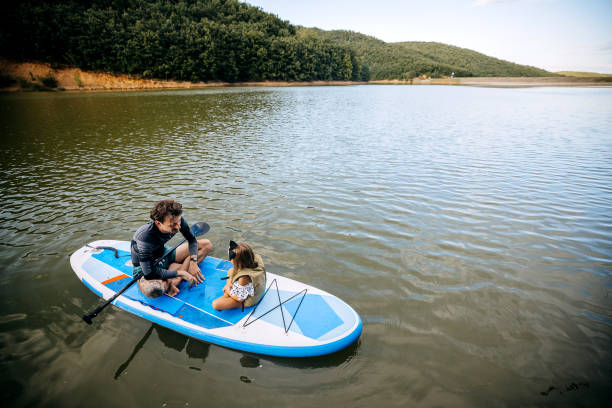 istock Father and daughter enjoying at the lake 1674500792