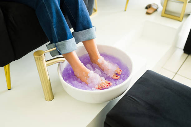 istock Mexican customer relaxing exfoliating her feet with a pedicure 1674532804
