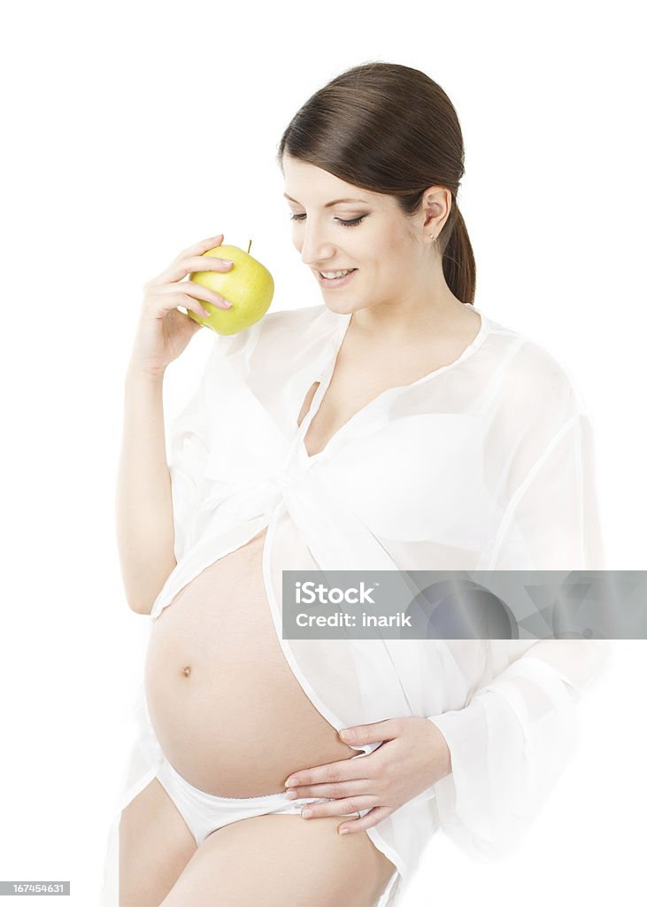 Schwangere Frau mit Apfel, Schwangerschaft und Ernährung - Lizenzfrei Abnehmen Stock-Foto