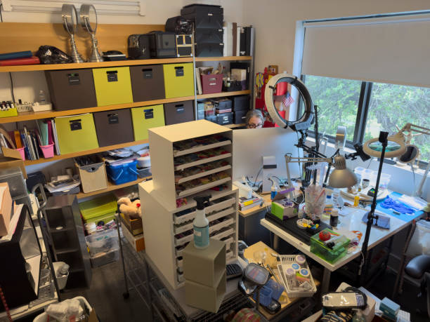 istock Woman working behind a desktop computer in a cluttered room 1674571511